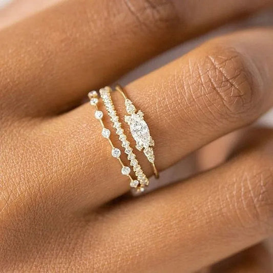 New rings with a modern design in a luxurious gold color, combining elegance and sophistication. Designed for women and girls in a sophisticated style suitable for various occasions, decorated with luxurious zircon and a luxu