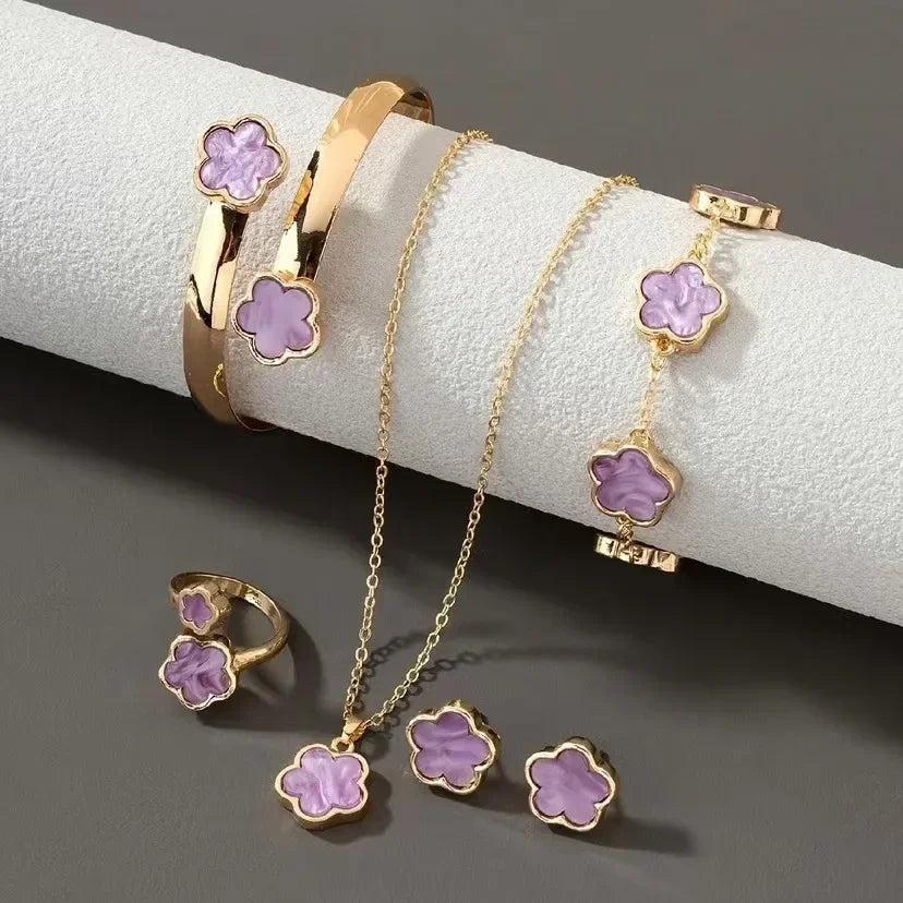 **5-Piece Luxury Jewelry Set** – A stunning set featuring **plum blossom plant design** with **five-leaf flowers**. Includes **earrings, rings, bracelet, necklace, and bangles**. Perfect as a gift for women who love elegant