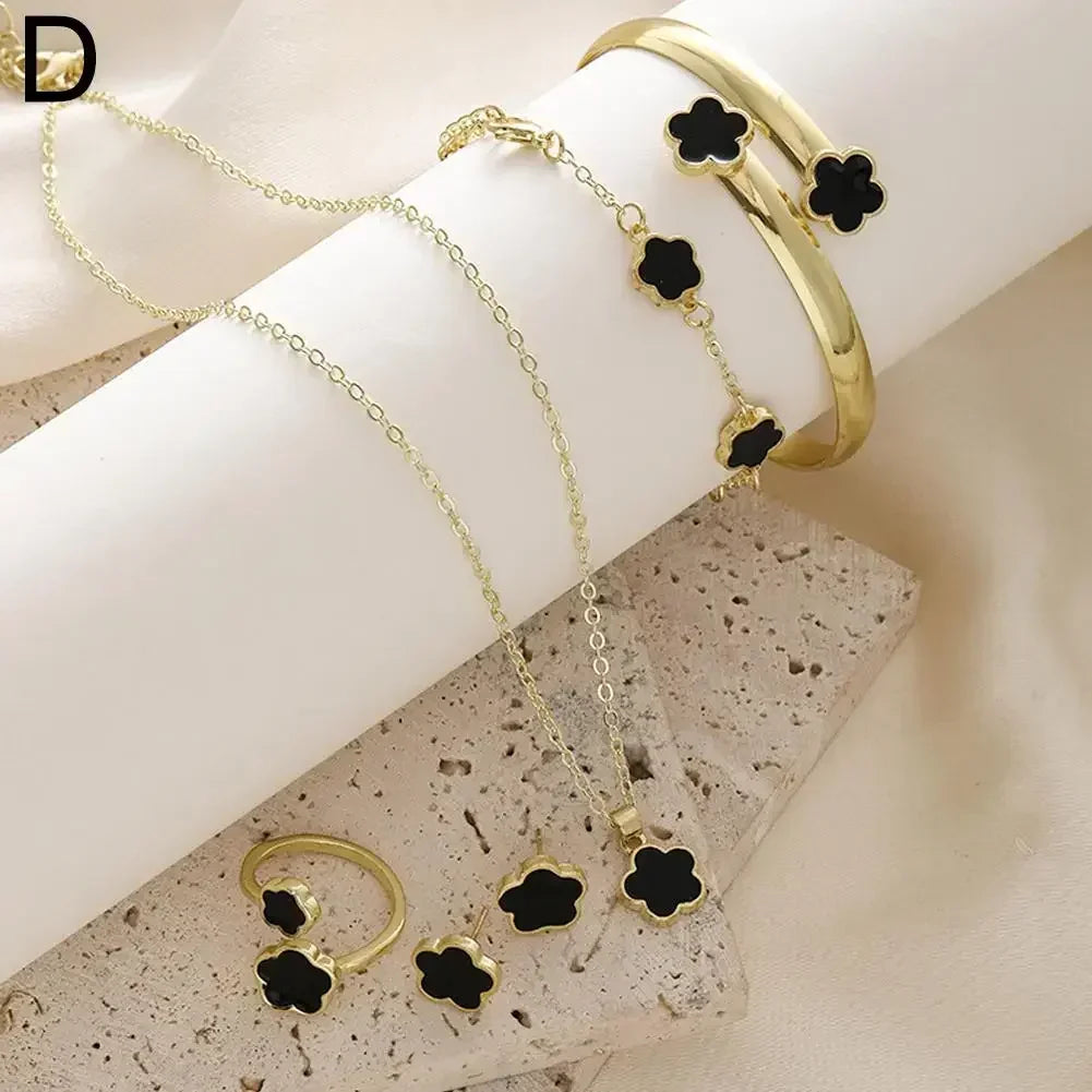 **5-Piece Luxury Jewelry Set** – A stunning set featuring **plum blossom plant design** with **five-leaf flowers**. Includes **earrings, rings, bracelet, necklace, and bangles**. Perfect as a gift for women who love elegant