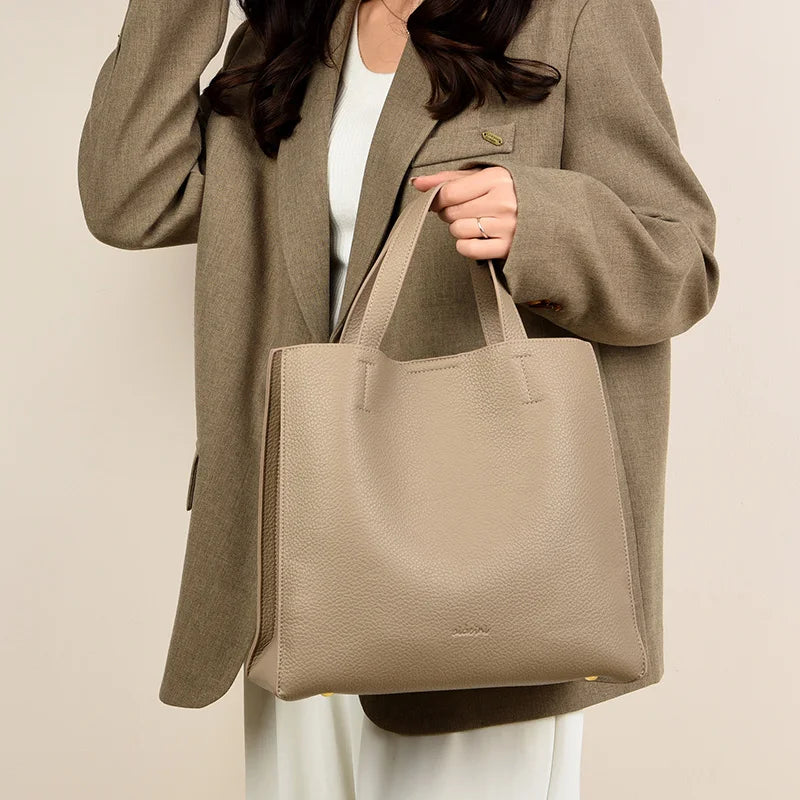 **2024 Elegant Leather Shoulder Bag** – A **fashionable and spacious handbag** designed for modern women. Featuring a **large capacity**, **simple solid design**, and a **commuter-friendly style**, it's perfect for everyday