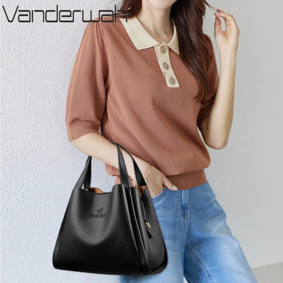 **VANDERWAH Genuine Leather Handbag** – A stylish and versatile **top-handle bag** crafted from **soft leather**, designed for women who value elegance and functionality. Features a **3-layer design**, making it perfect for