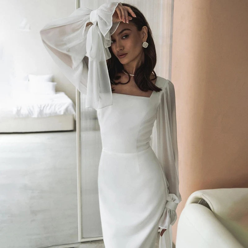 Elegant white dress with transparent sleeves