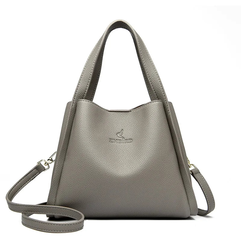 **VANDERWAH Genuine Leather Handbag** – A stylish and versatile **top-handle bag** crafted from **soft leather**, designed for women who value elegance and functionality. Features a **3-layer design**, making it perfect for